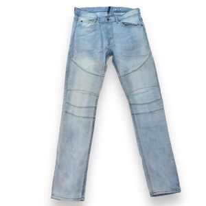 Divided light wash skinny moto button fly jeans